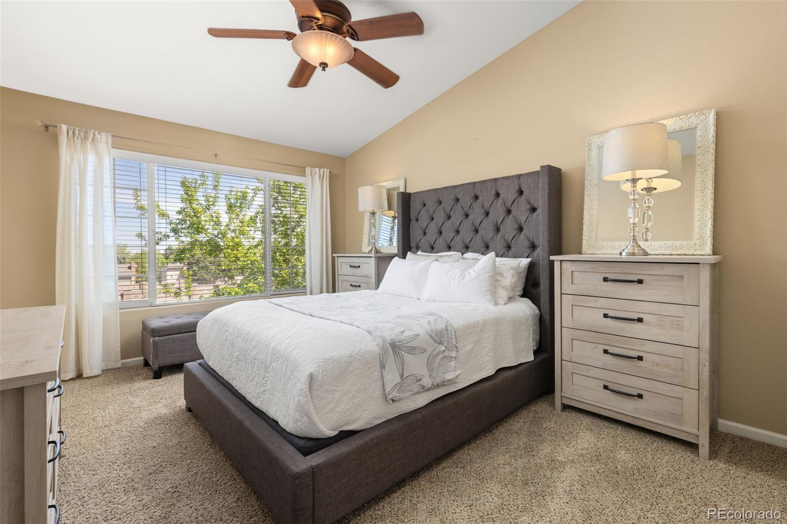 8334 Pebble Creek Way, Unit 201 Highlands Ranch, CO 80126 - Photo 14 of 28 a bed room with a bed and a window