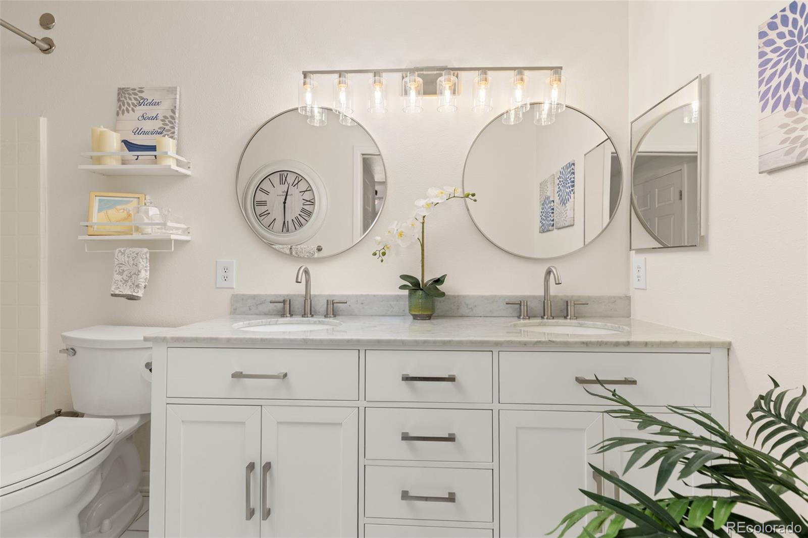 8334 Pebble Creek Way, Unit 201 Highlands Ranch, CO 80126 - Photo 16 of 28 a bathroom with a sink and a mirror