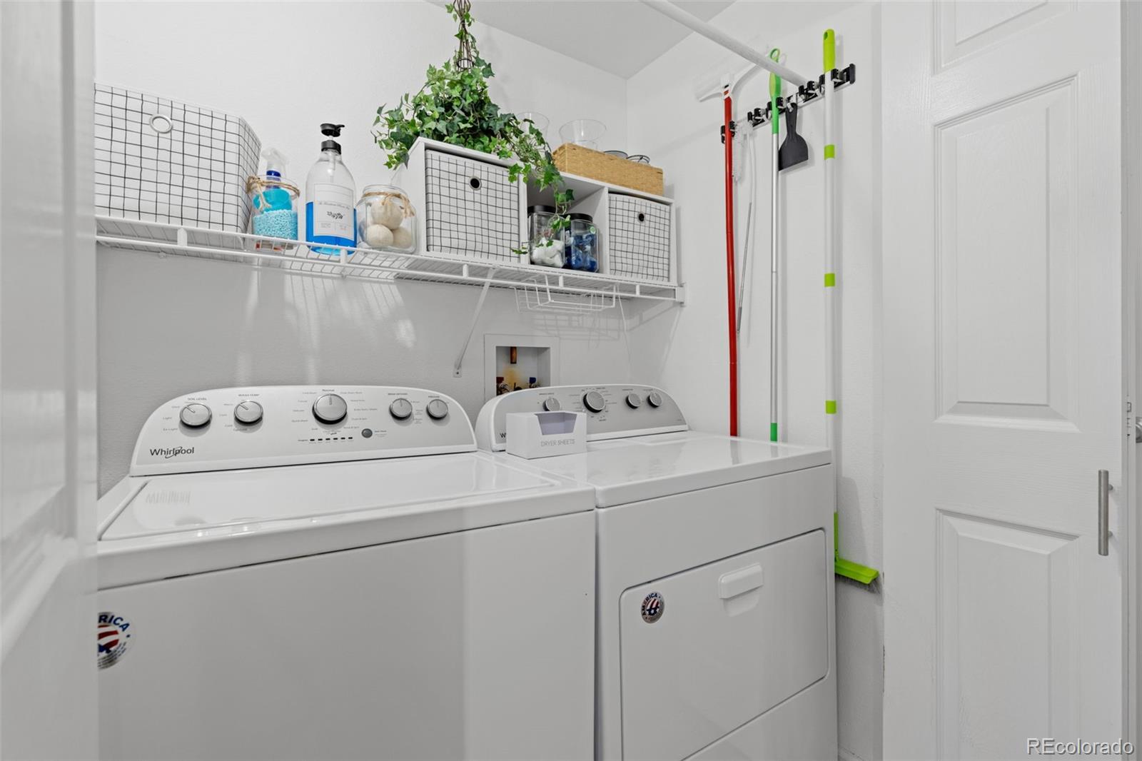 8334 Pebble Creek Way, Unit 201 Highlands Ranch, CO 80126 - Photo 19 of 28 a utility room with dryer and washer