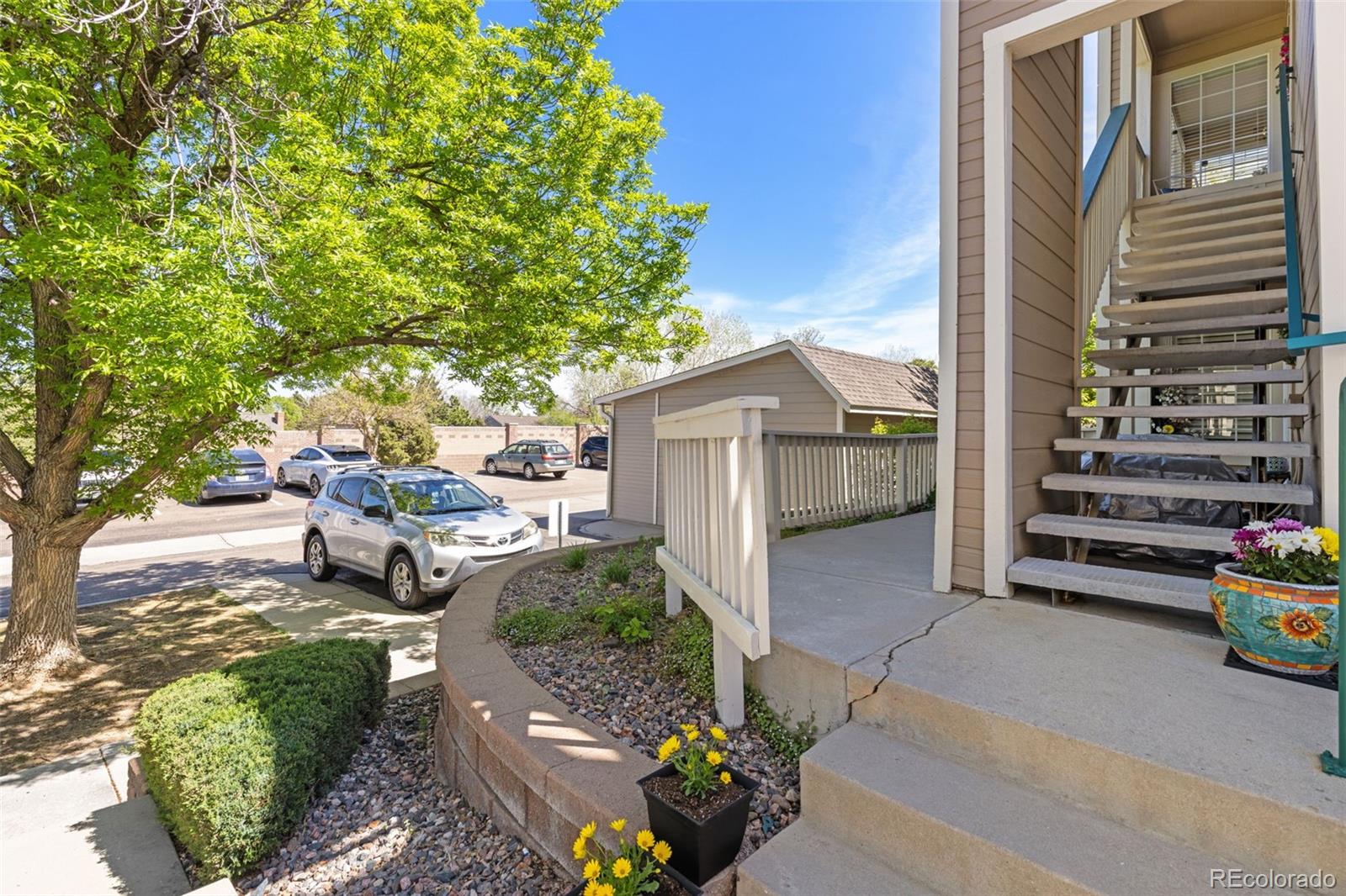8334 Pebble Creek Way, Unit 201 Highlands Ranch, CO 80126 - Photo 28 of 28 a view of backyard with outdoor seating and green space