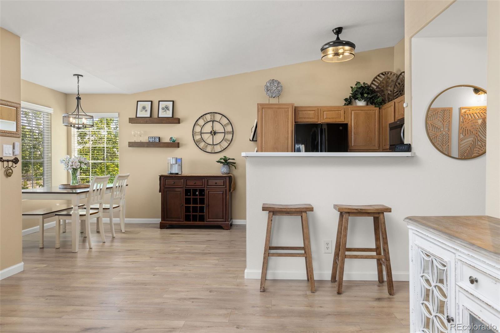 8334 Pebble Creek Way, Unit 201 Highlands Ranch, CO 80126 - Photo 7 of 28 a living room with furniture and a large window