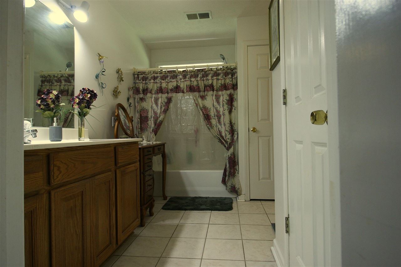 585 Cliffview Road Bolivar, TN 38008 - Photo 7 of 22 a bathroom with a sink and a mirror