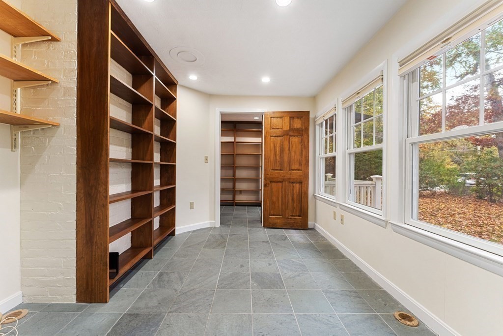575 Chestnut Street Newton, MA 02468 - Photo 17 of 30 a view of an empty room with a window and cabinet