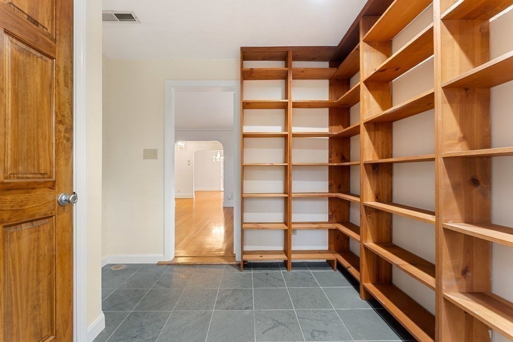 575 Chestnut Street Newton, MA 02468 - Photo 18 of 30 a view of walk in closet with empty racks