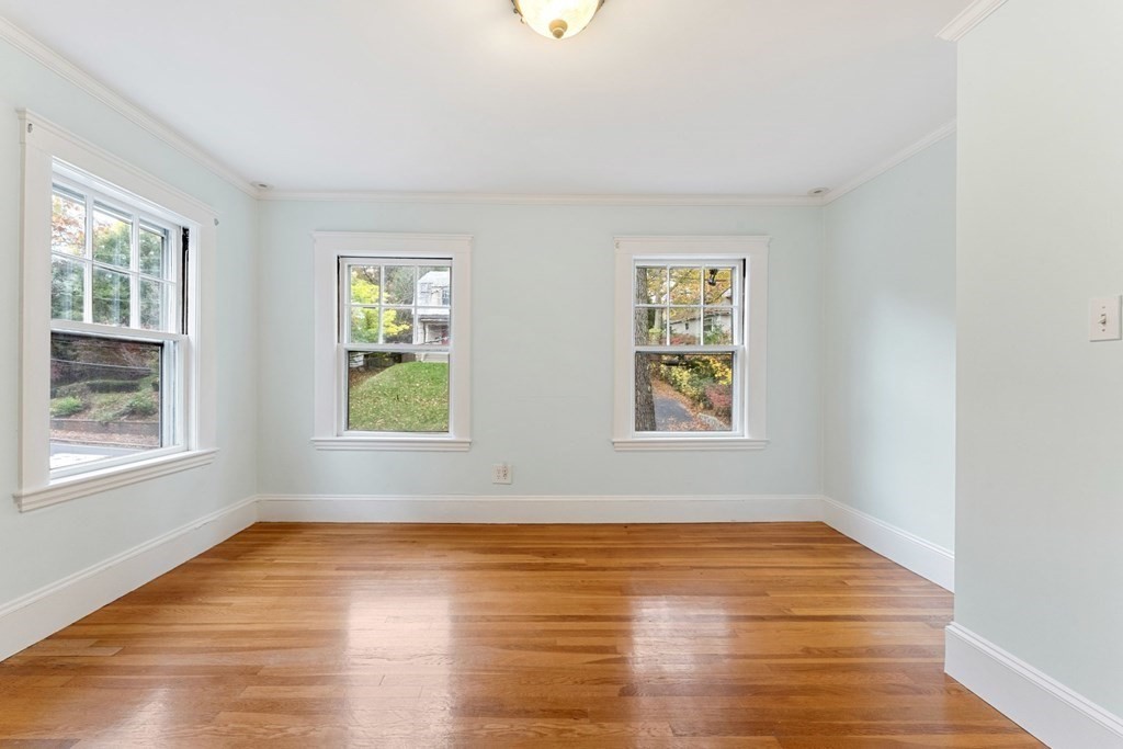 575 Chestnut Street Newton, MA 02468 - Photo 20 of 30 a view of an empty room with wooden floor and a window