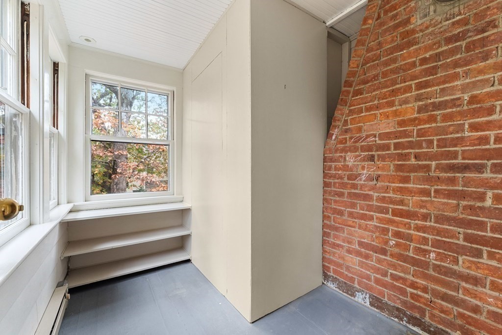 575 Chestnut Street Newton, MA 02468 - Photo 27 of 30 a bathroom with a bathtub and window
