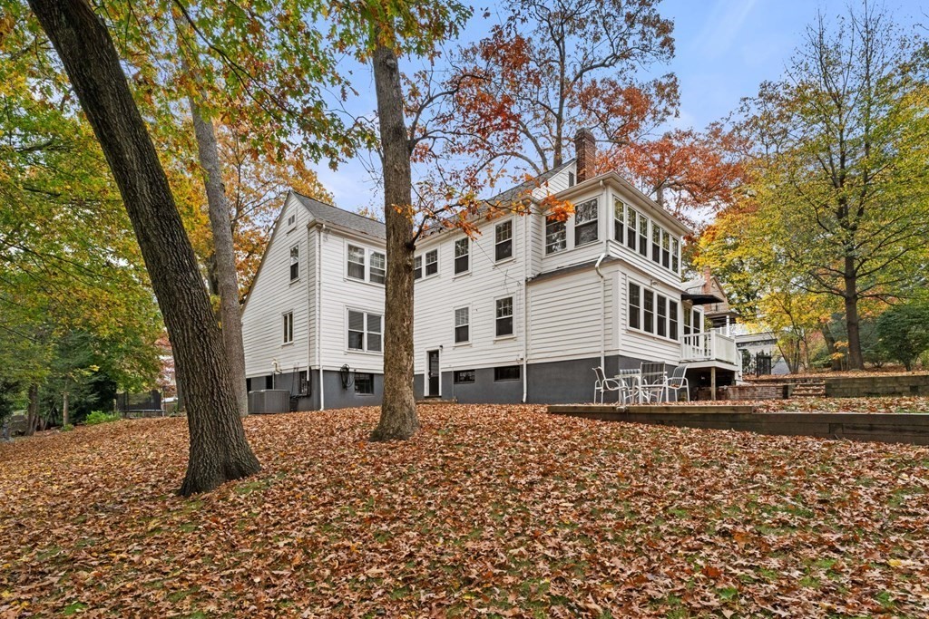 575 Chestnut Street Newton, MA 02468 - Photo 29 of 30 a front view of a building with large trees