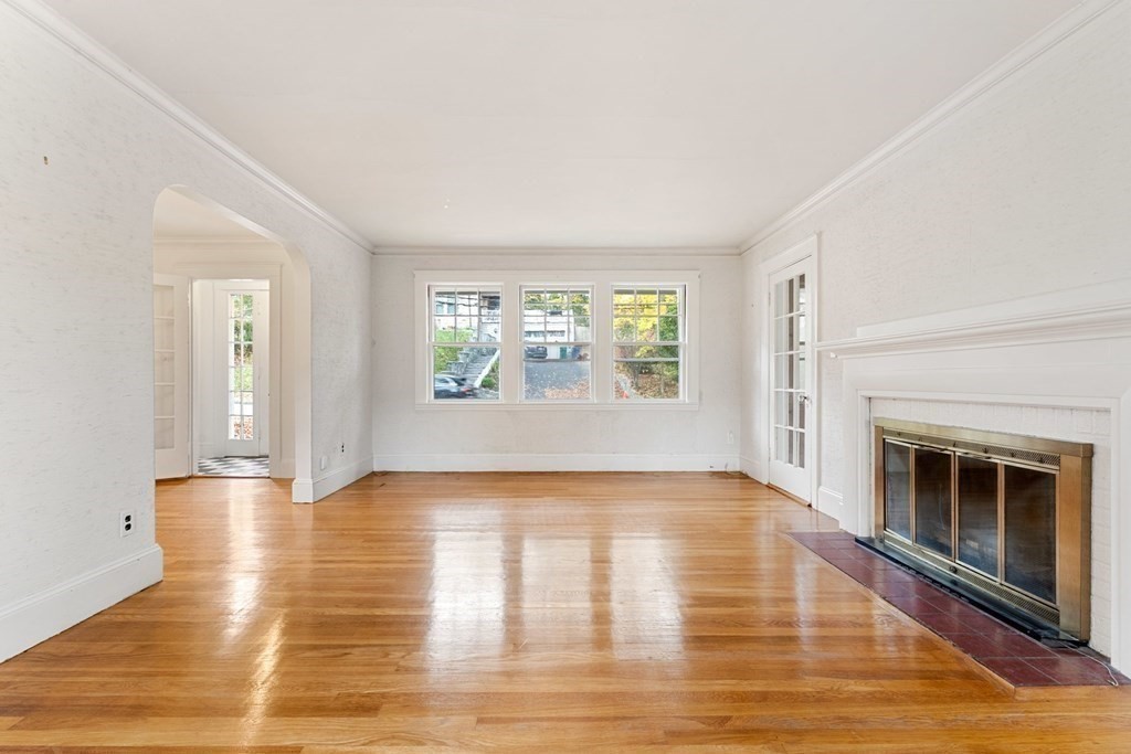 575 Chestnut Street Newton, MA 02468 - Photo 6 of 30 a view of an empty room with window and wooden floor
