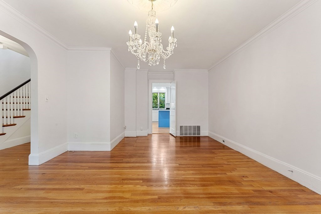 575 Chestnut Street Newton, MA 02468 - Photo 7 of 30 a view of an empty room with window and wooden floor