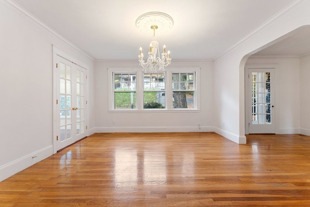 575 Chestnut Street Newton, MA 02468 - Photo 8 of 30 a view of empty room with wooden floor and fan