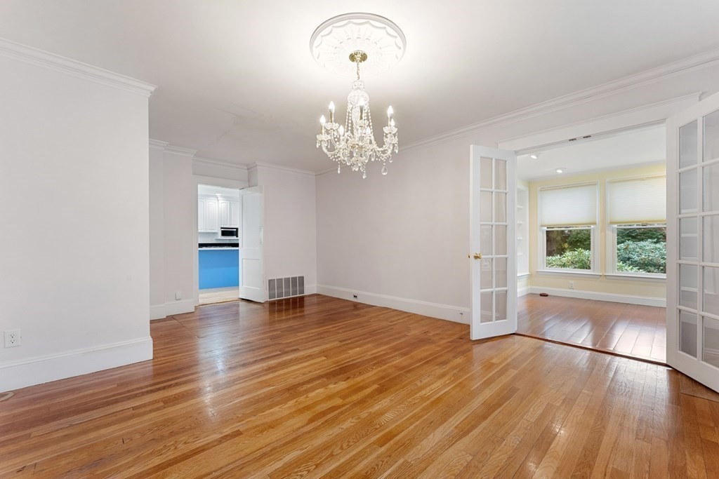 575 Chestnut Street Newton, MA 02468 - Photo 9 of 30 a view of empty room with wooden floor and fan