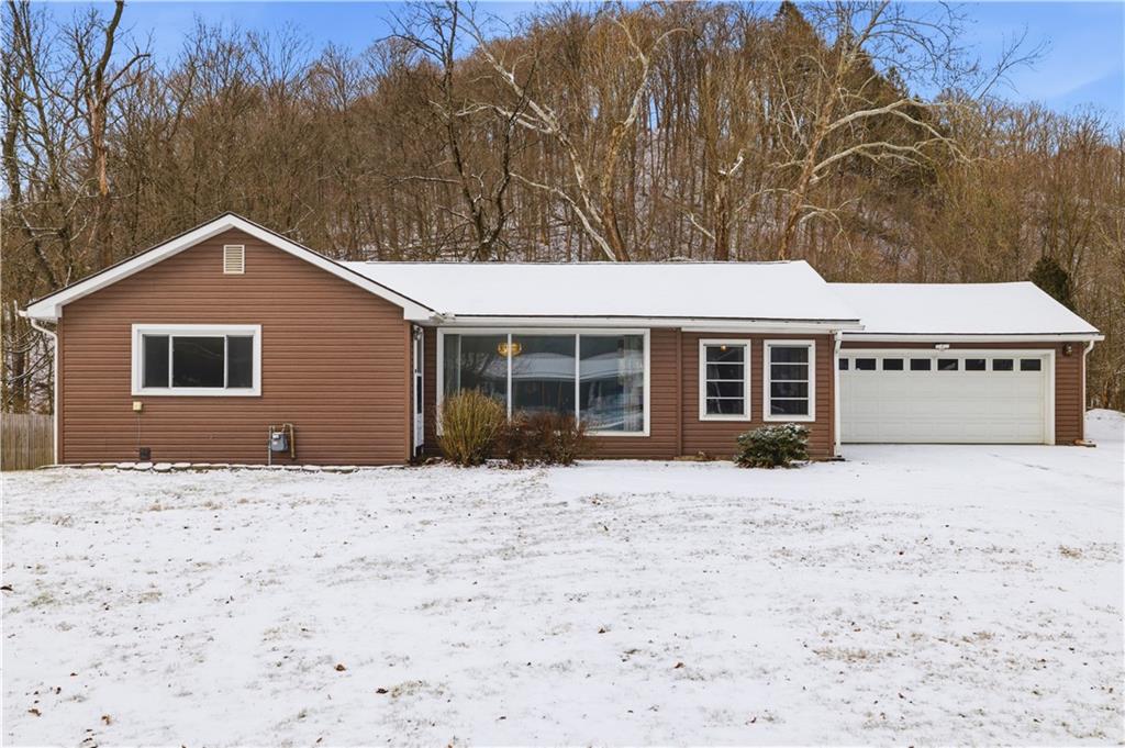 2161 Bull Creek Road Tarentum, PA 15084 - Photo 1 of 32 a front view of a house with a yard