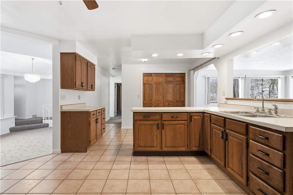 2161 Bull Creek Road Tarentum, PA 15084 - Photo 13 of 32 a large kitchen with a sink and cabinets