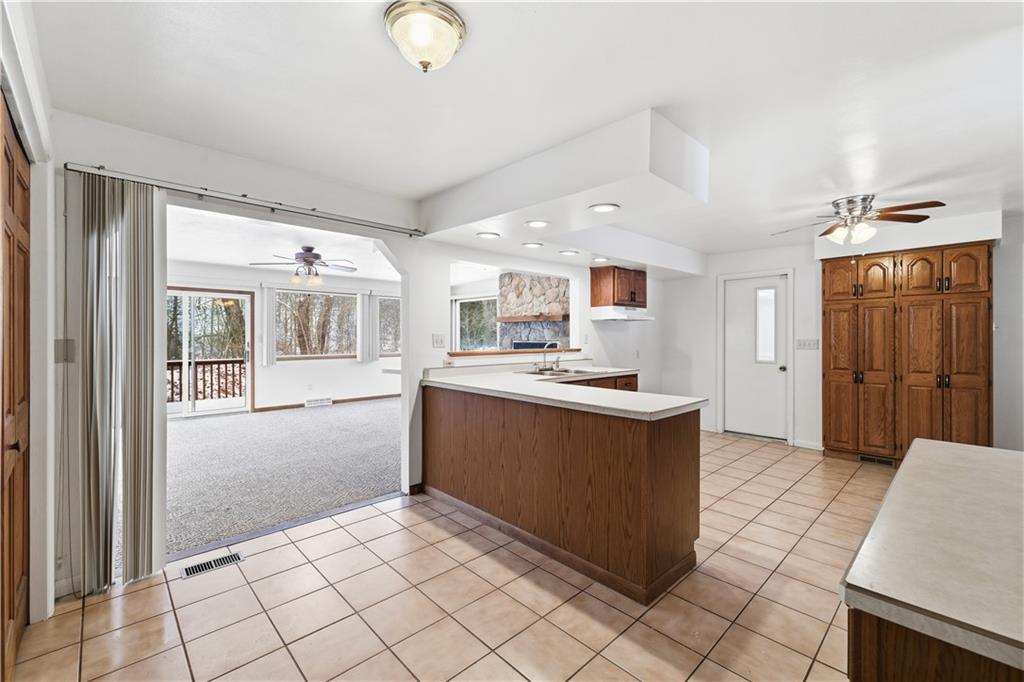 2161 Bull Creek Road Tarentum, PA 15084 - Photo 14 of 32 a kitchen with stainless steel appliances granite countertop a refrigerator and a sink