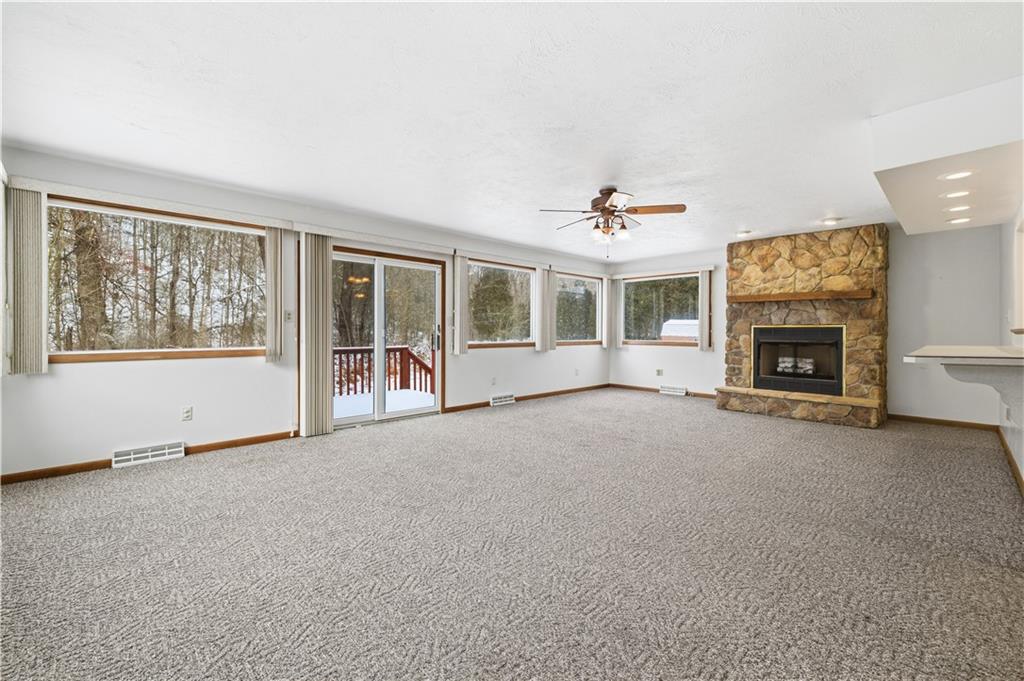 2161 Bull Creek Road Tarentum, PA 15084 - Photo 17 of 32 an empty room with furniture and a fireplace