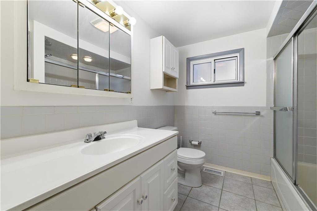 2161 Bull Creek Road Tarentum, PA 15084 - Photo 23 of 32 a bathroom with a sink a toilet and shower