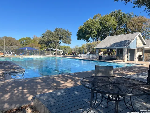 a view of a house with backyard porch and sitting area