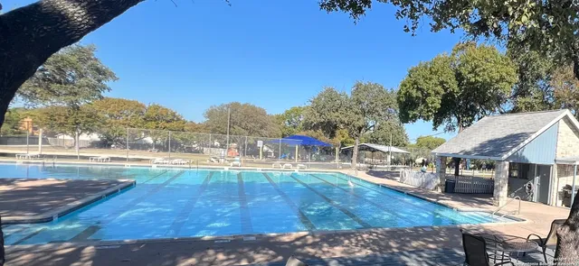 a view of a swimming pool with a patio