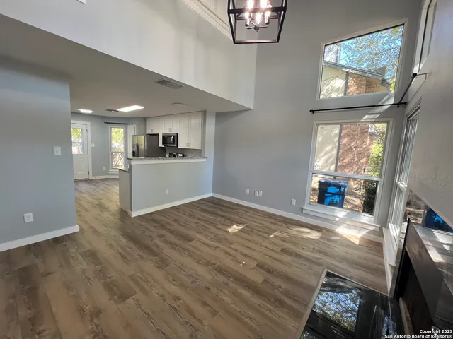 a view of a kitchen with furniture and windows