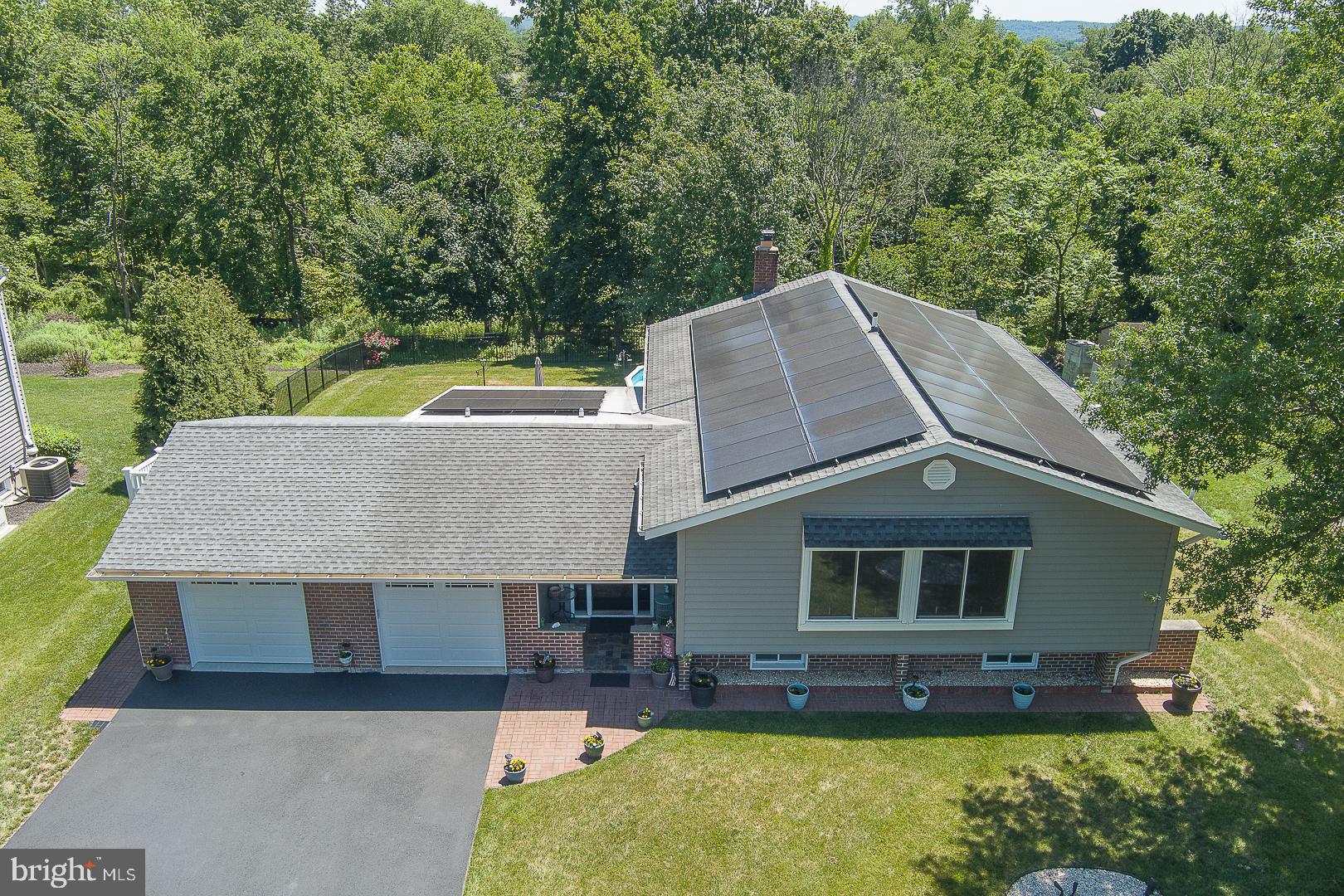848 Mourning Dove Road Audubon, PA 19403 - Photo 74 of 86 an aerial view of a house with swimming pool next to a yard