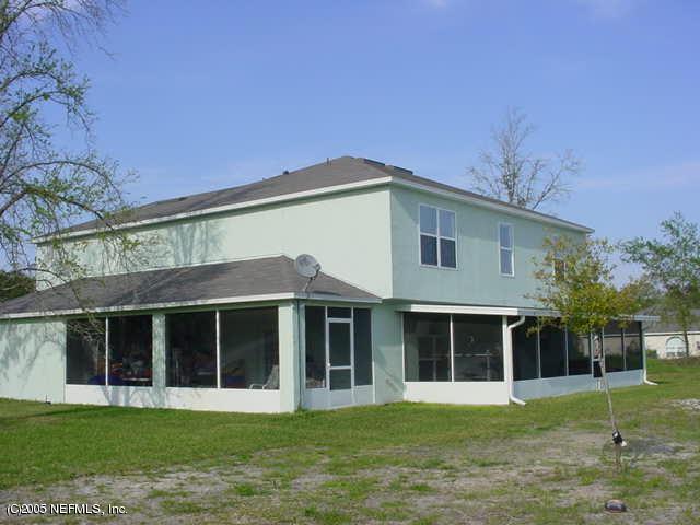55365 Little Brook Drive Callahan, FL 32011 - Photo 2 of 9 a front view of a house with a yard