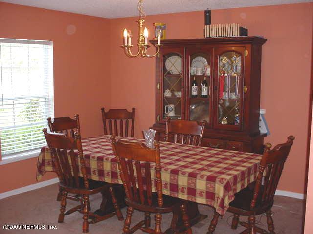 55365 Little Brook Drive Callahan, FL 32011 - Photo 3 of 9 a view of a dining room with furniture and window