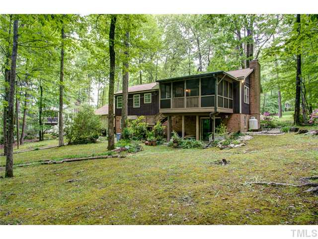 5822 Scalybark Road Durham, NC 27712 - Photo 25 of 25 This view of the back of the house shows how large the back yard is, as well, as the private patio off the family room. Exterior Back