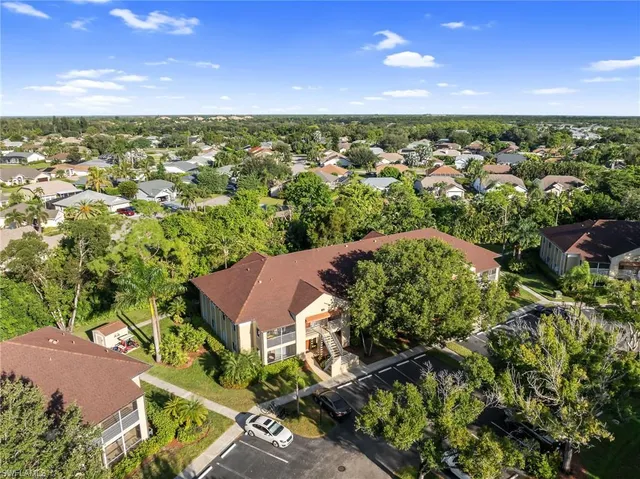 an aerial view of residential houses with city view