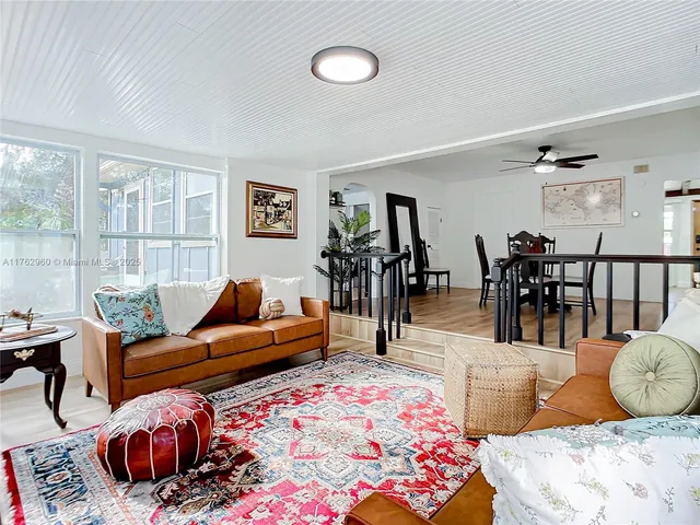 a bedroom with furniture and wooden floor