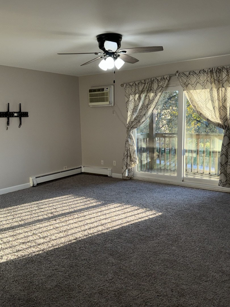 19380 Wolf Road, Unit 5 Mokena, IL 60448 - Photo 12 of 20 a view of an empty room with a window