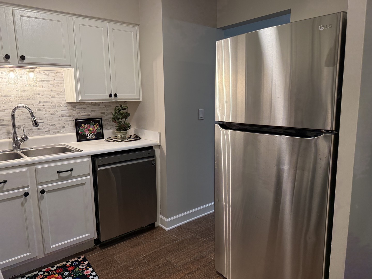 19380 Wolf Road, Unit 5 Mokena, IL 60448 - Photo 5 of 20 a kitchen with stainless steel appliances granite countertop a refrigerator sink and cabinets