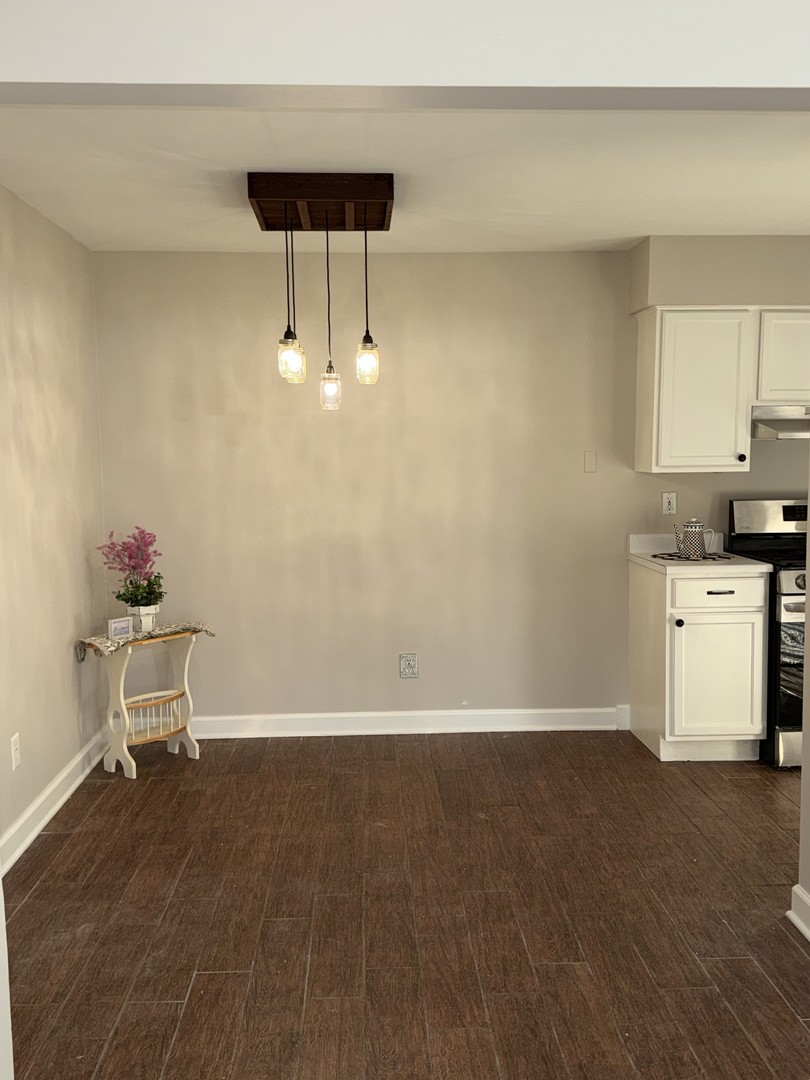 19380 Wolf Road, Unit 5 Mokena, IL 60448 - Photo 9 of 20 a view of kitchen with furniture and wooden floor