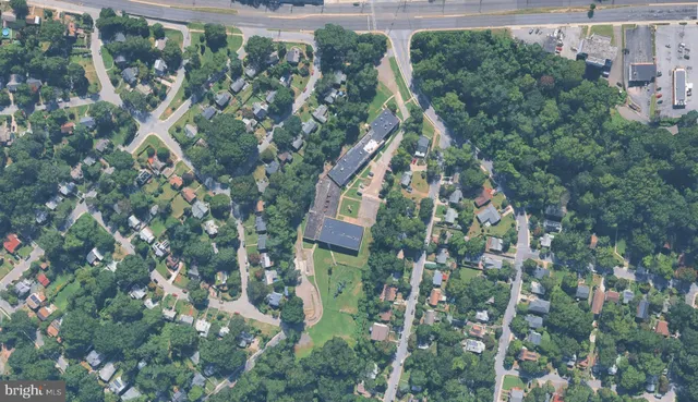 an aerial view of a house with yard