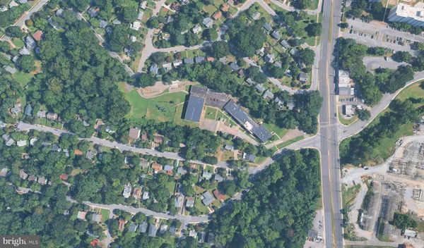 a aerial view of a houses with yard