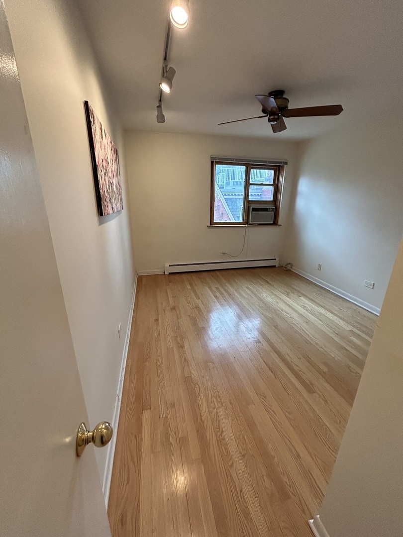 401 West Webster Avenue, Unit 502 Chicago, IL 60614 - Photo 6 of 9 wooden floor in an empty room with a window