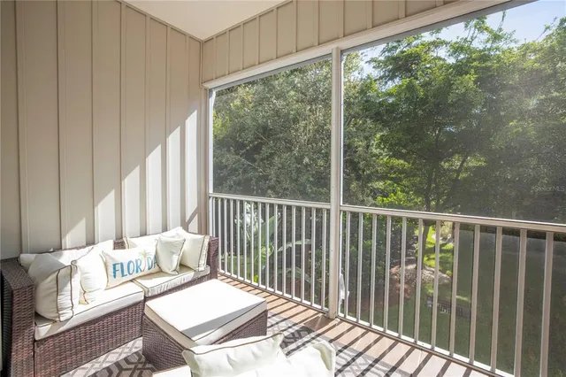 a view of a kitchen with wooden floor and closet area