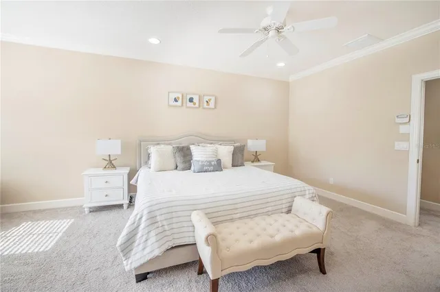 a bedroom with a bed and a night lamp