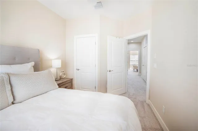 a view of a house with a backyard and a patio