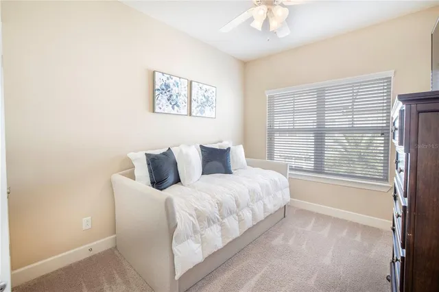 a view of a patio with a dining table and chairs with a yard
