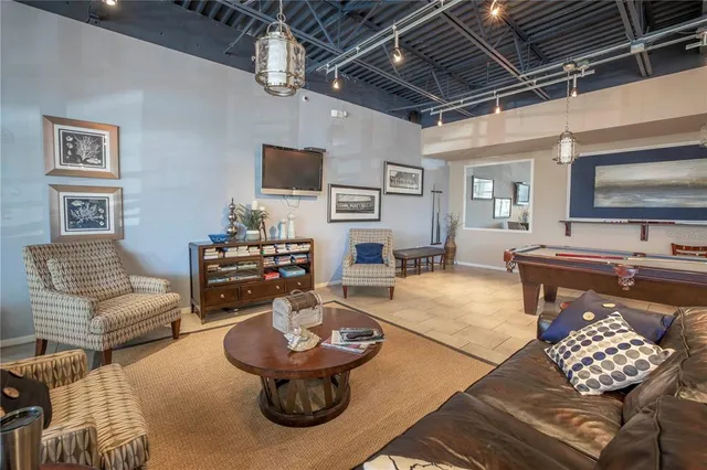 a view of a patio with a table and chairs