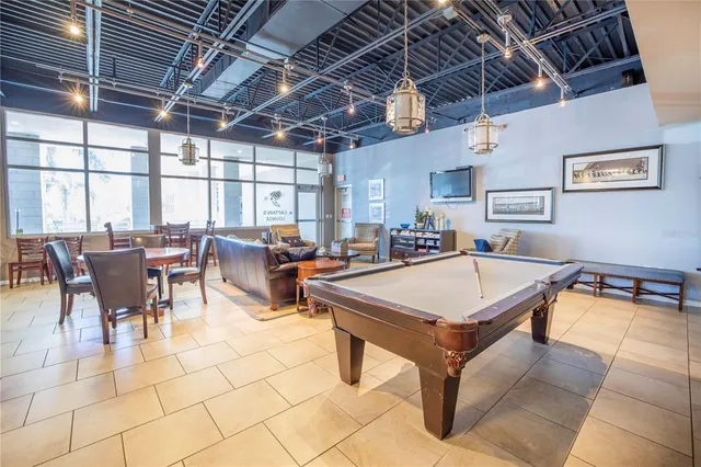 a swimming pool with outdoor seating and yard