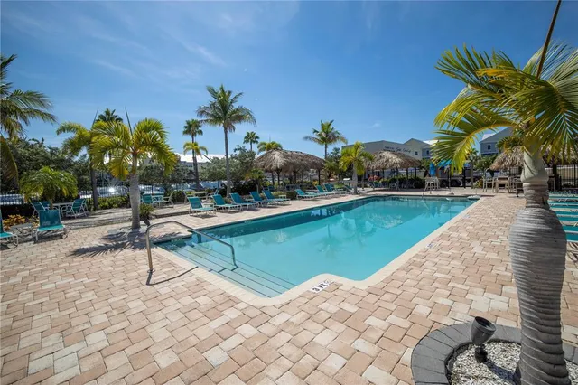 a front view of a residential apartment building with a yard