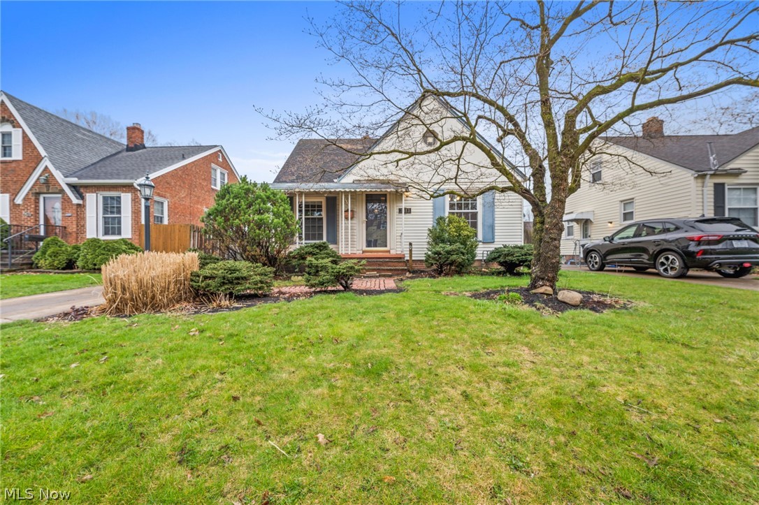2513 Ralph Avenue Cleveland, OH 44109 - Photo 1 of 14 View of front of property featuring a front yard