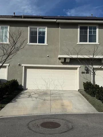 a house view with a backyard space