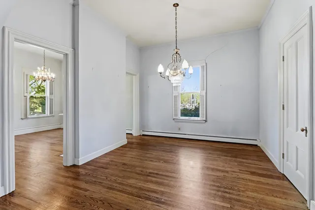 a view of entryway with wooden floor