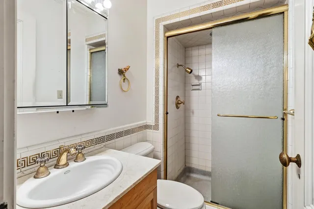 en empty room with windows and chandelier