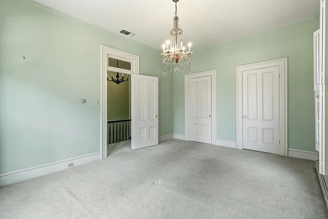 a view of entryway with wooden floor and stairs
