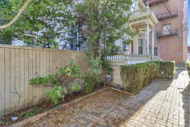a view of a brick building with many windows