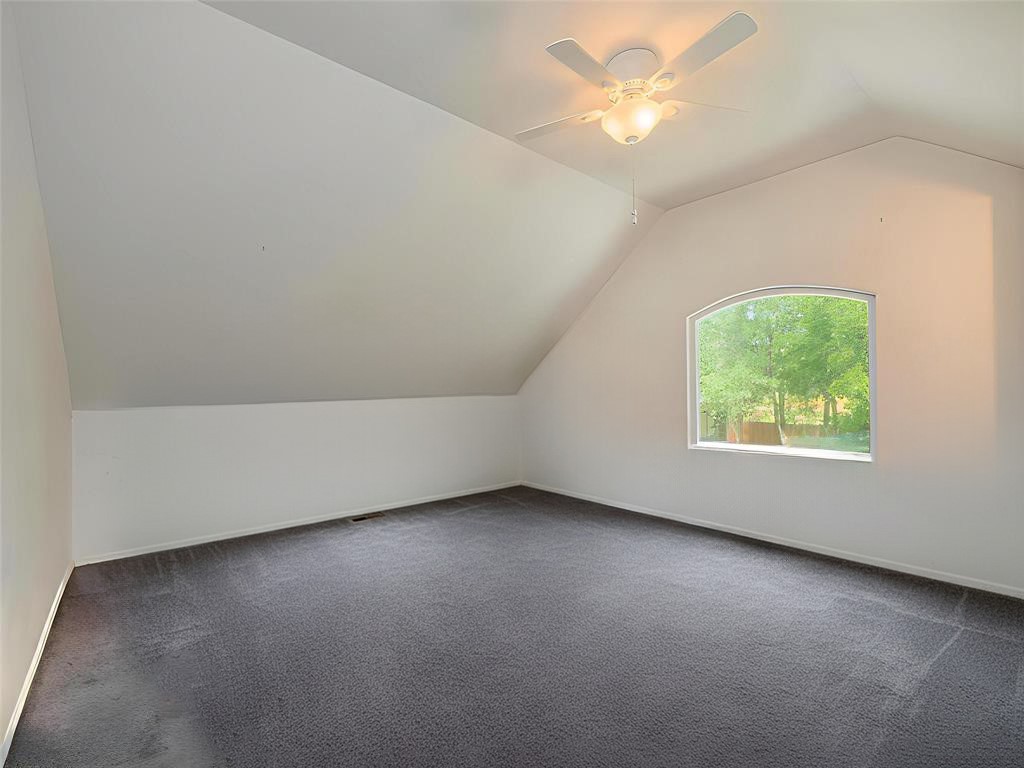 368 Riddle Road Cedar Creek, TX 78612 - Photo 12 of 16 an empty room with a window and a ceiling fan