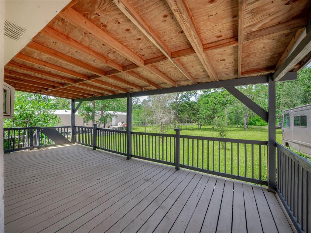 368 Riddle Road Cedar Creek, TX 78612 - Photo 3 of 16 a view of a wooden deck
